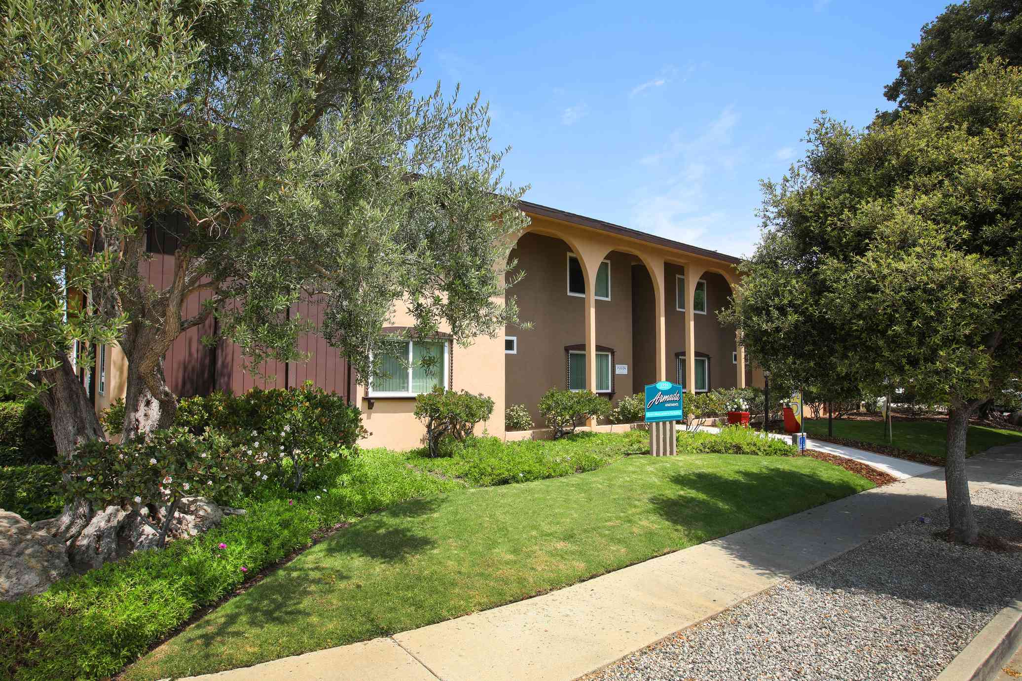 garden style exterior with mature shade trees