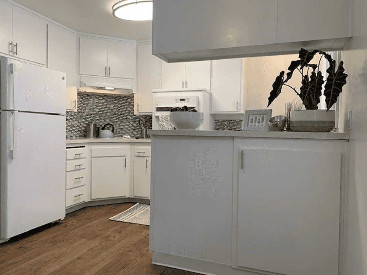 open kitchen layout with shaker style cabinets