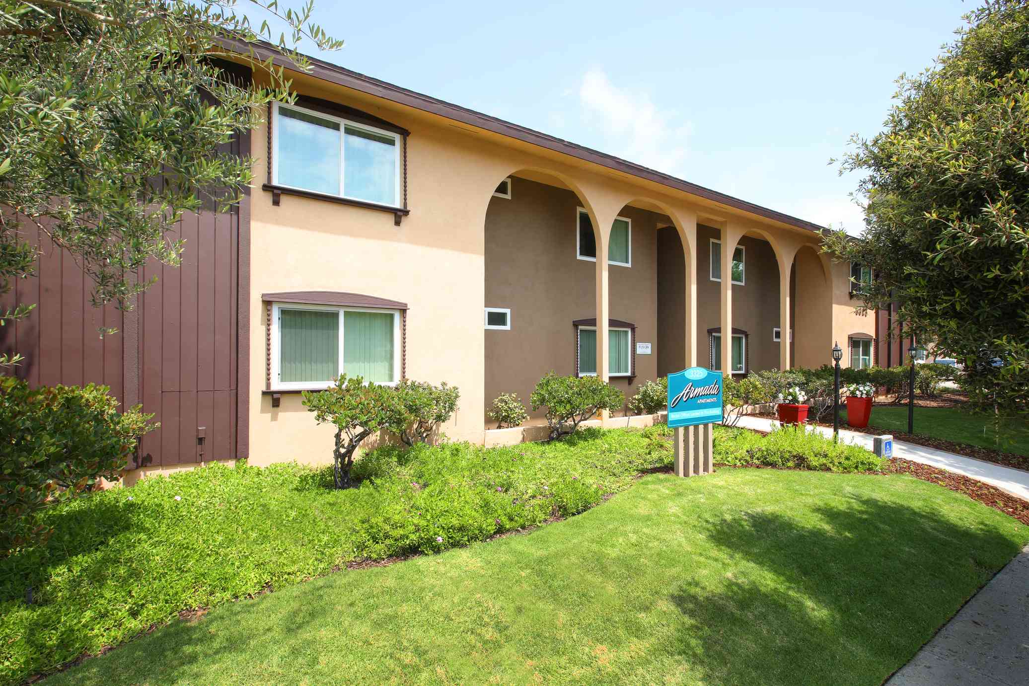 manicured front lawn and modern exterior