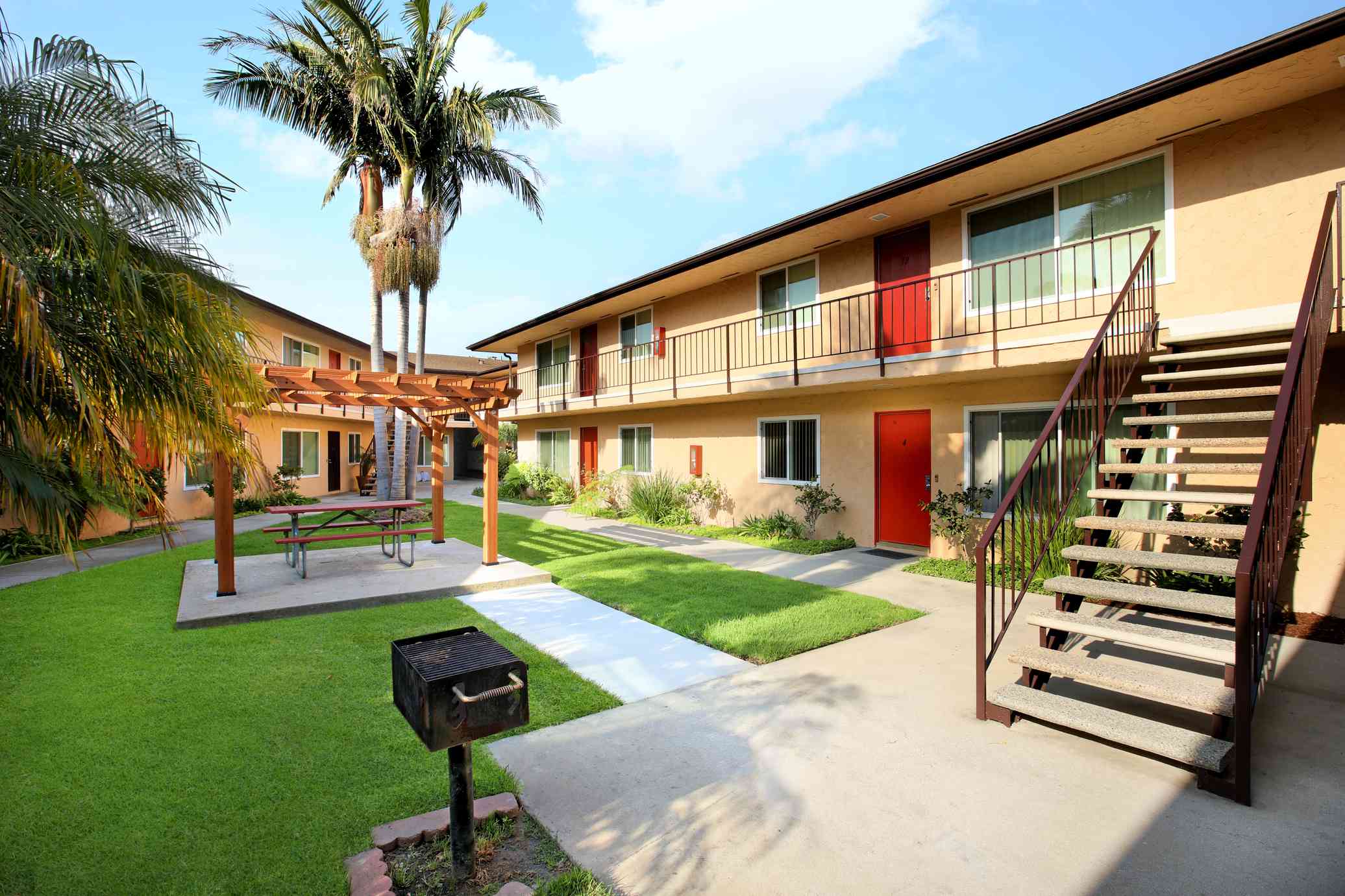 outdoor bbq grill and shaded pergola area