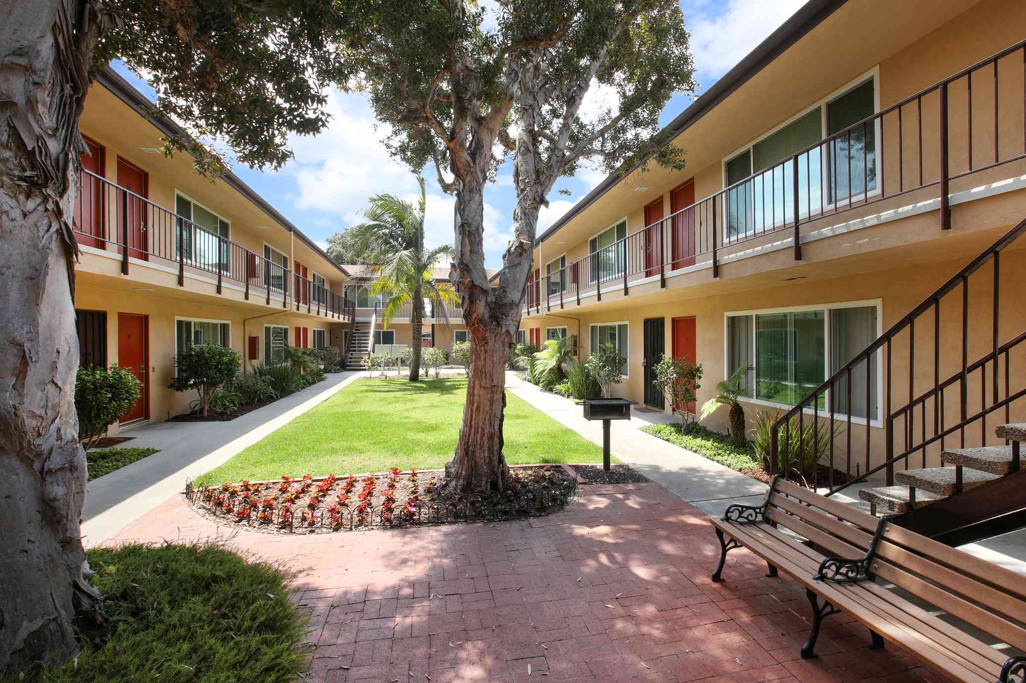 shaded brick patio with community seating