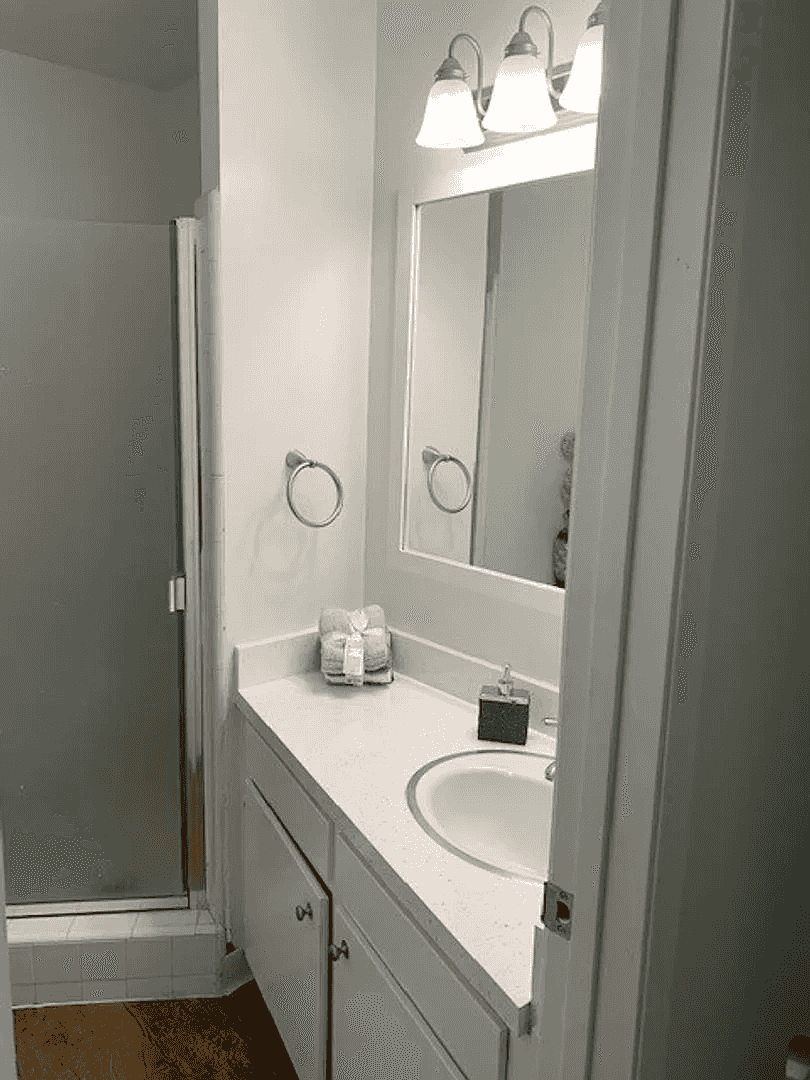 renovated bathroom vanity with quartz style counters